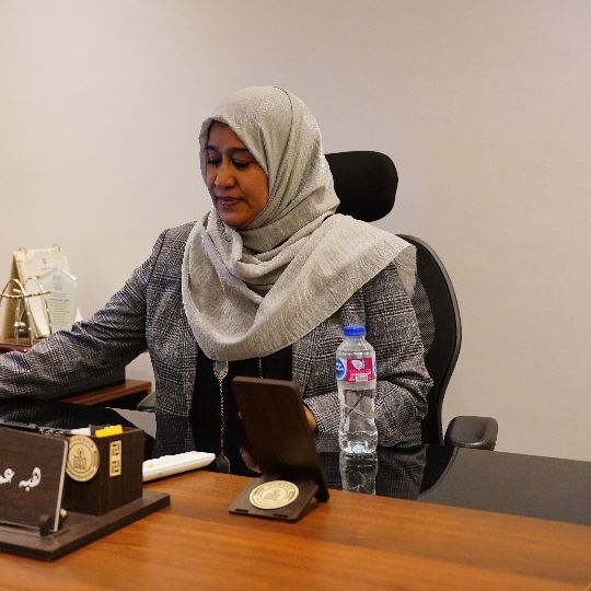 Dr. Heba Omer Mohamed Abdelrahman at her desk