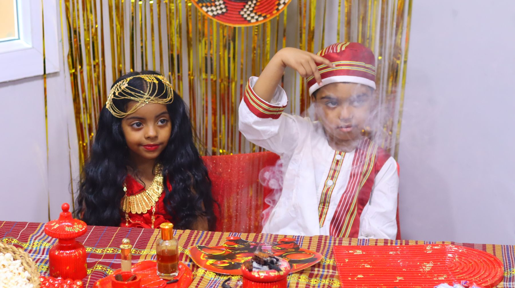 Two children in traditional Sudanese dress on Traditional Day